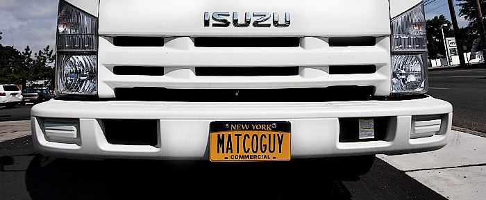 Close up shot of a mobile tool truck with their custom license plate that says MATCO GUY.